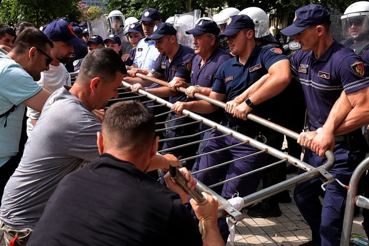 Albanian riot police deploy water cannons outside parliament building in Tirana during Kushner resort protests July 2026