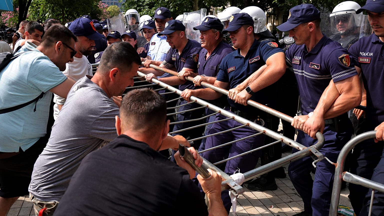 Albanian riot police deploy water cannons against protesters outside parliament in Tirana during Kushner resort demonstrations July 2026