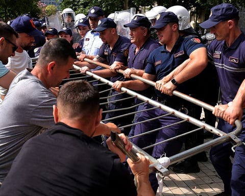 Albanian riot police deploy water cannons against protesters outside parliament in Tirana during Kushner resort demonstrations July 2026