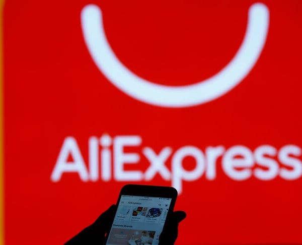 AliExpress logo displayed on a smartphone screen against EU flag background