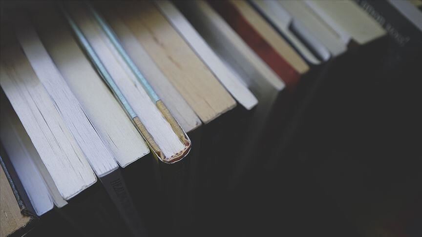 Books representing the AI copyright dispute as Anthropic settles $1.5 billion claim over training data