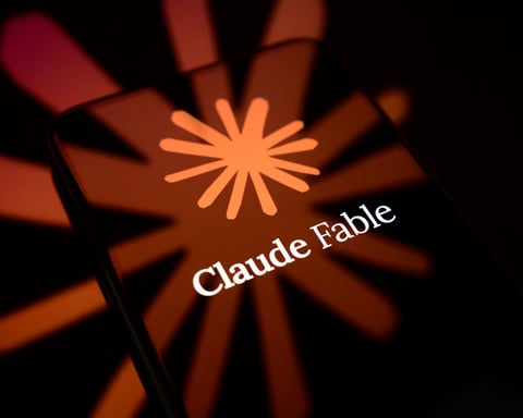 The Claude logo displayed on a smartphone screen in a photo illustration