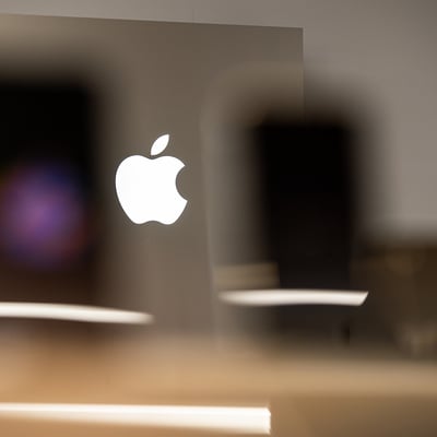 Apple logo representing the company's AI strategy and market cap leadership over Nvidia
