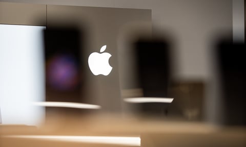 Apple logo representing the company's AI strategy and market cap leadership over Nvidia