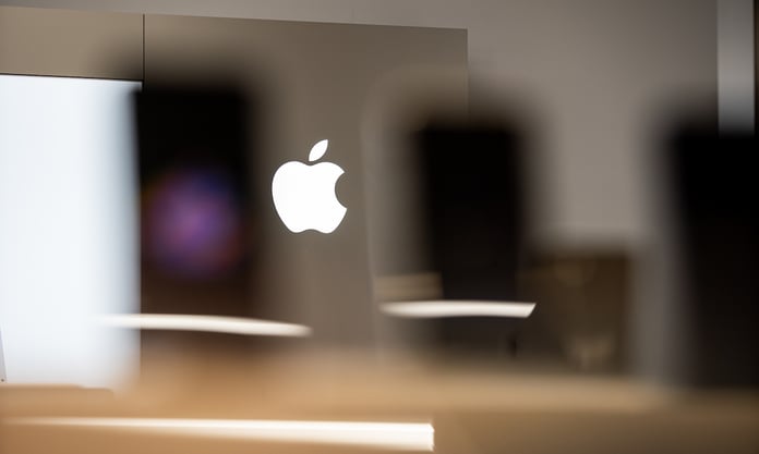 Apple logo representing the company's AI strategy and market cap leadership over Nvidia