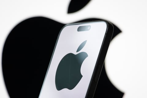 Photo illustration of the Apple logo displayed on a smartphone screen