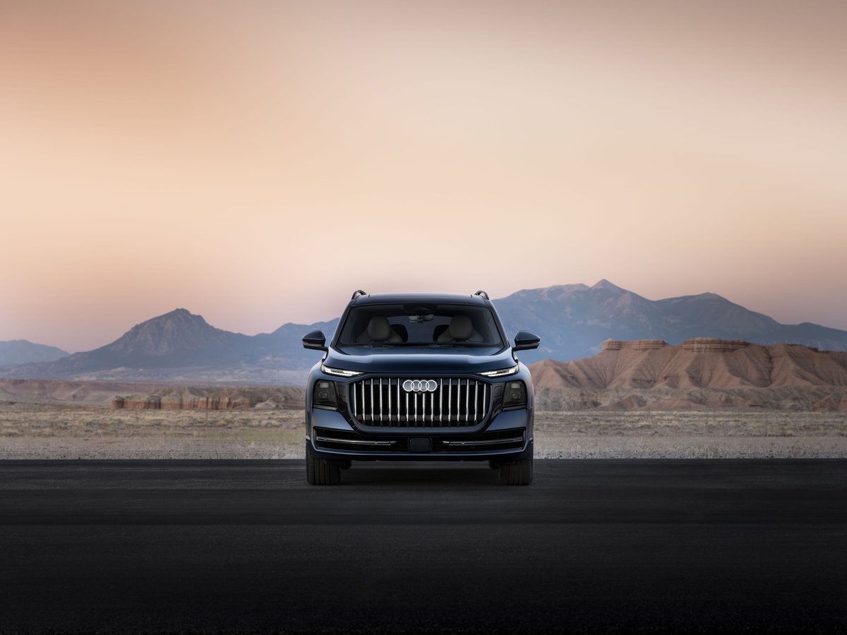 2027 Audi Q9 flagship SUV exterior in silver on a dark background