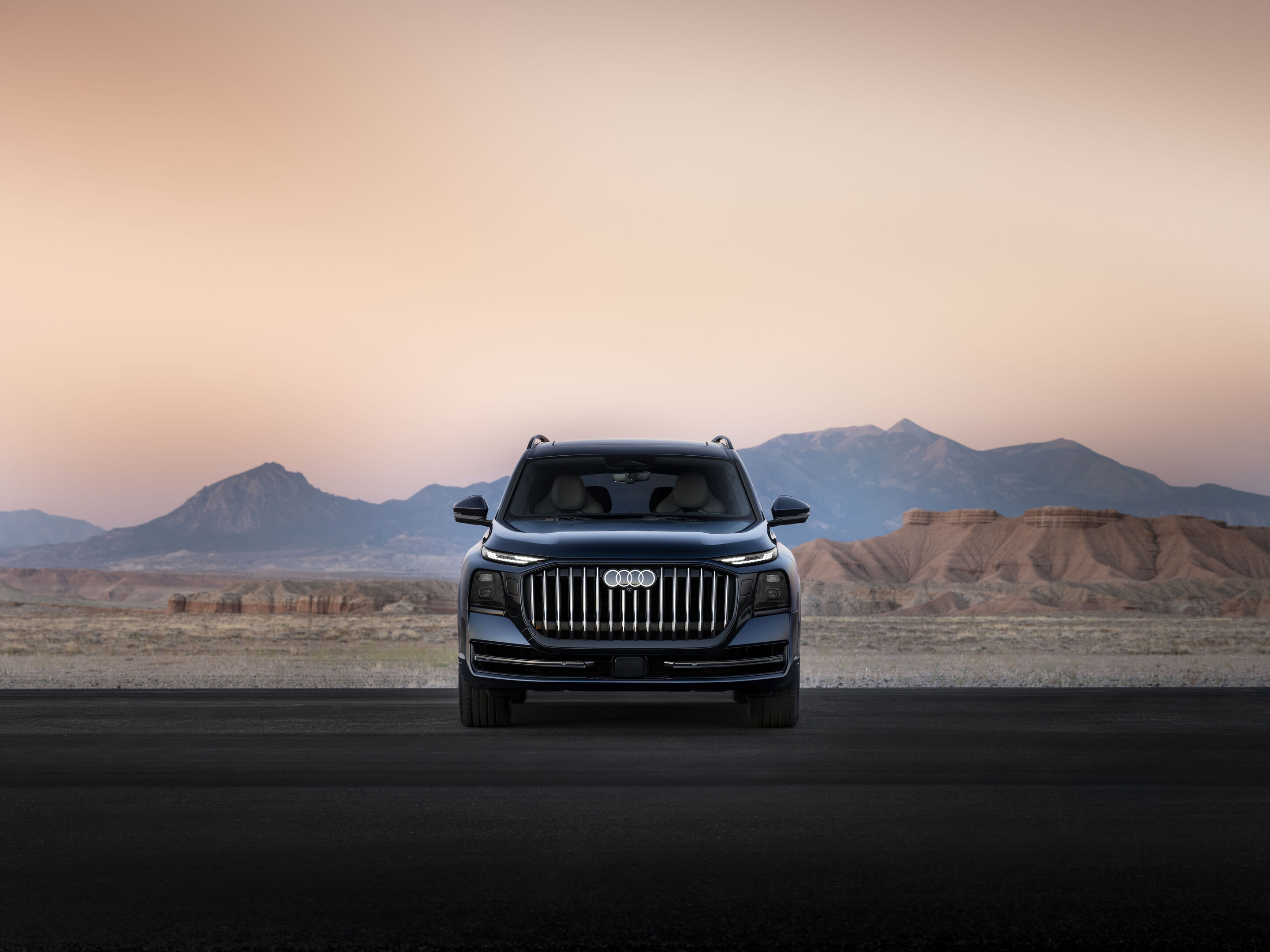 2027 Audi Q9 flagship SUV exterior in silver on a dark background