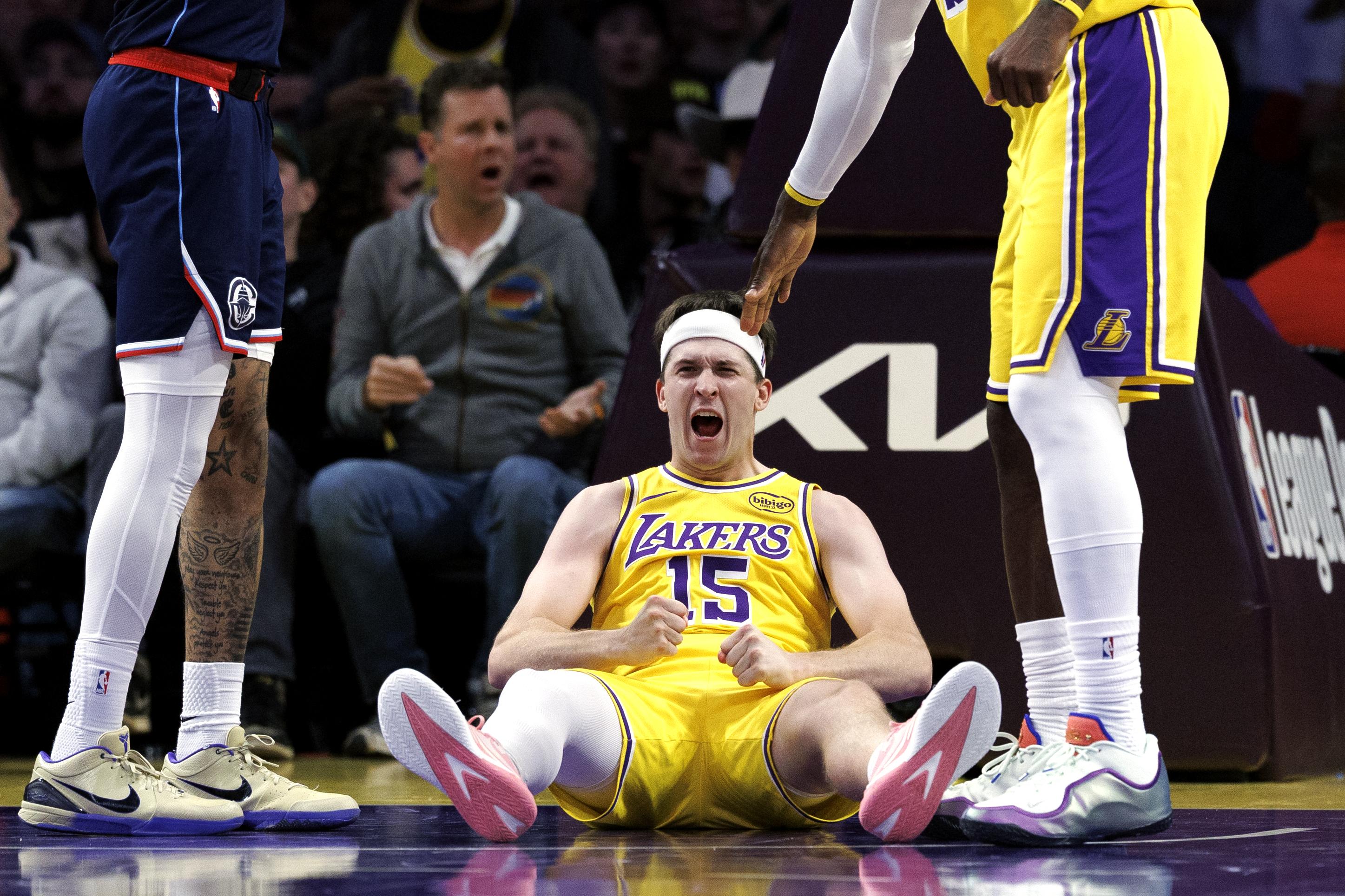 Austin Reaves celebrating with Los Angeles Lakers teammates after signing record NBA contract