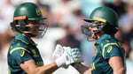 Beth Mooney and Ashleigh Gardner celebrate Australia's eight-wicket win over West Indies in the Women's T20 World Cup semifinal at The Oval