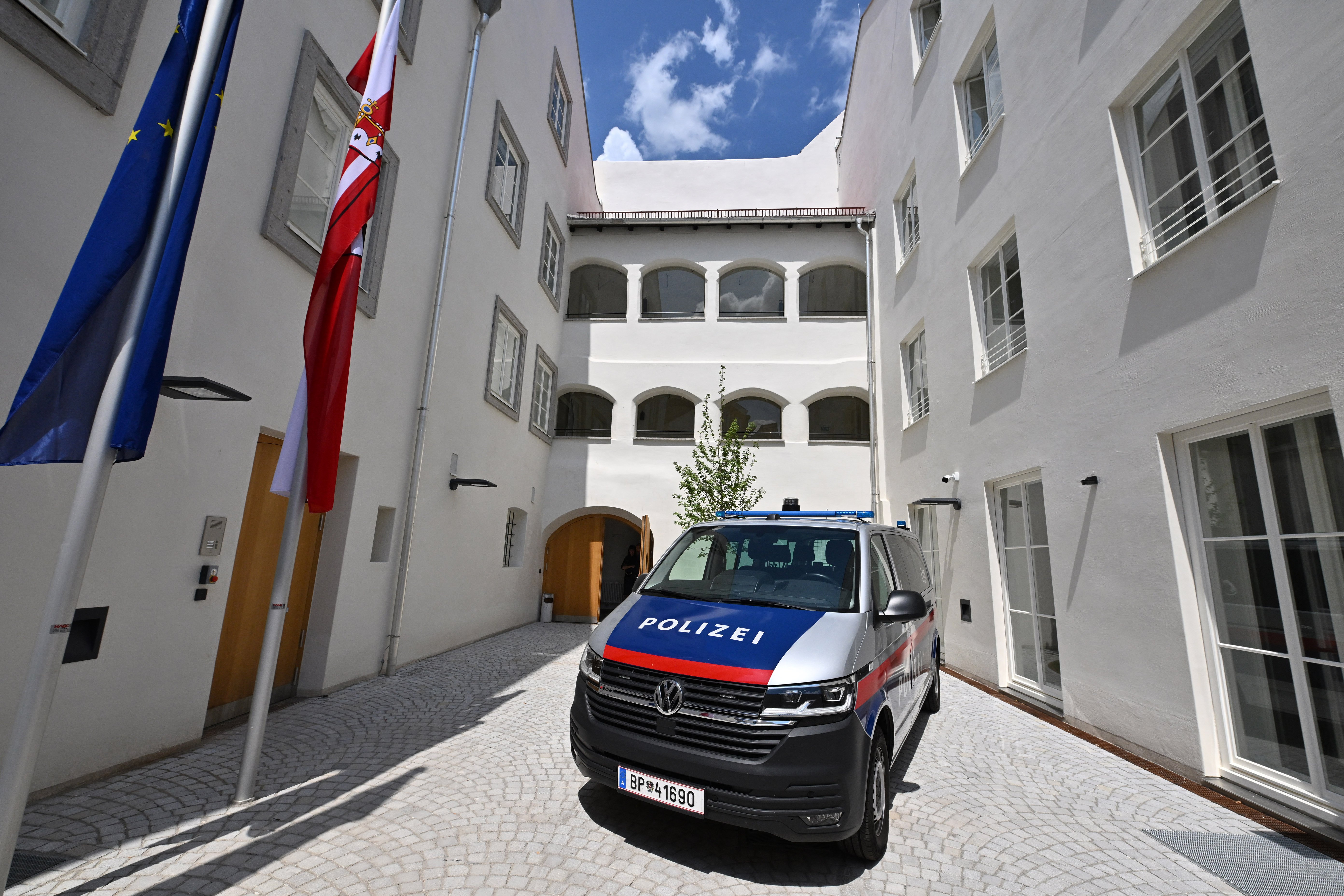 Austrian police car parked in the courtyard of the former Hitler birthplace building in Braunau am Inn, now a police station