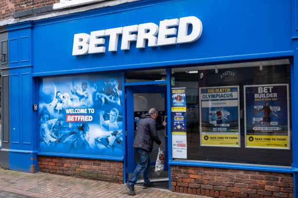 Betfred bookmakers storefront on Mill Street high street shopping area, Macclesfield, United Kingdom