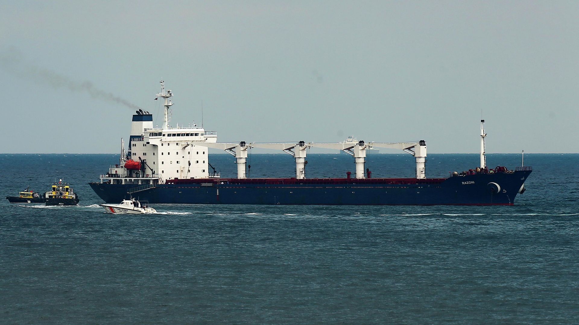Inspection officials board a cargo vessel in the Black Sea under the grain deal