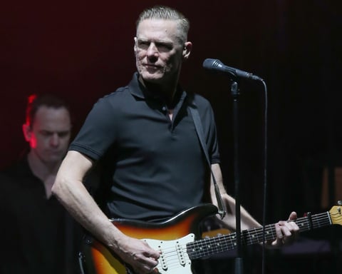 Canadian rock singer Bryan Adams performing on stage