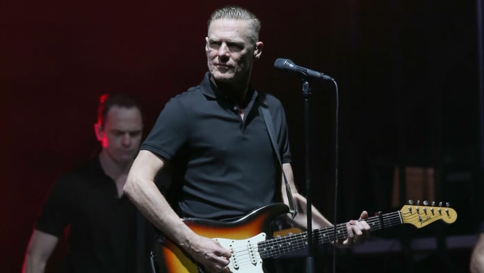 Canadian rock singer Bryan Adams performing on stage