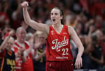 Caitlin Clark dribbling in Indiana Fever uniform during the WNBA game vs Seattle Storm