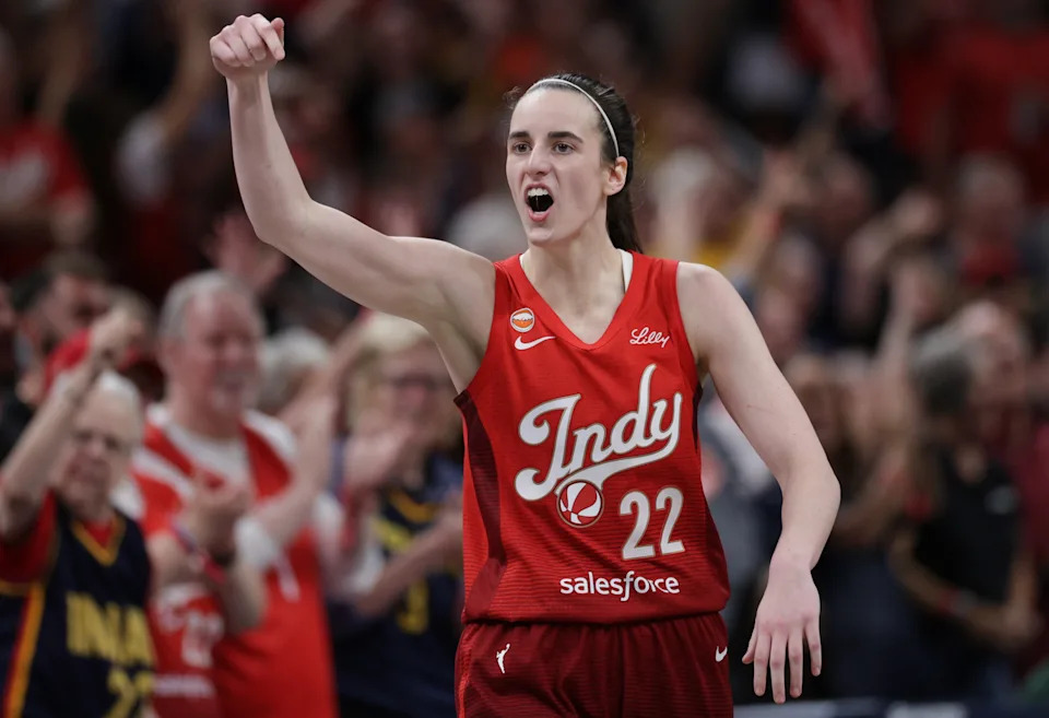 Caitlin Clark dribbling in Indiana Fever uniform during the WNBA game vs Seattle Storm