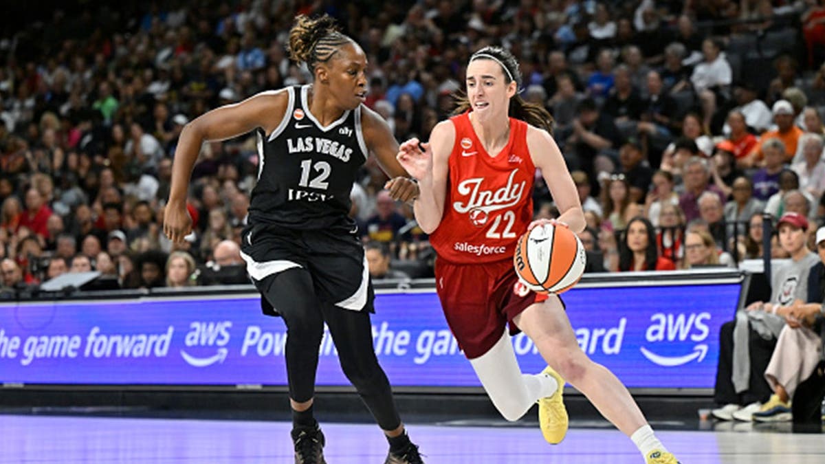 Caitlin Clark dribbling for Indiana Fever setting WNBA assist record