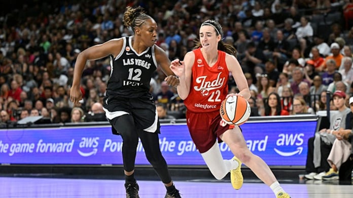 Caitlin Clark dribbling for Indiana Fever setting WNBA assist record