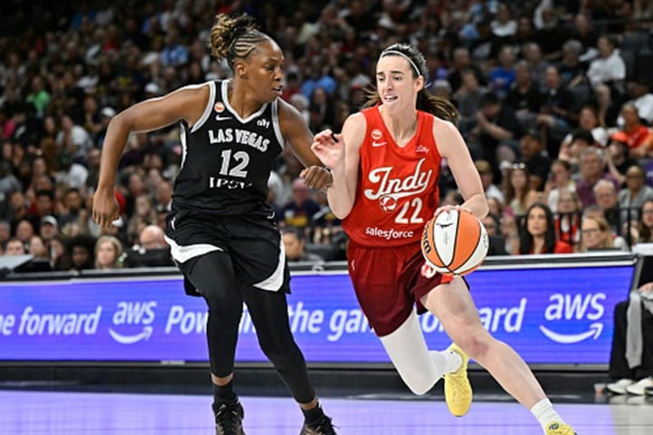 Caitlin Clark dribbling for Indiana Fever setting WNBA assist record
