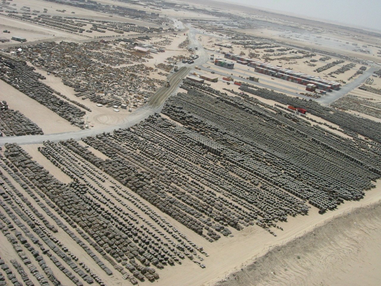 Aerial view of US military logistics storage facilities at Camp Arifjan in Kuwait, a key American supply hub targeted in IRGC retaliation strikes