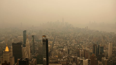 Wildfire smoke from Canadian wildfires creates orange haze over New York City skyline