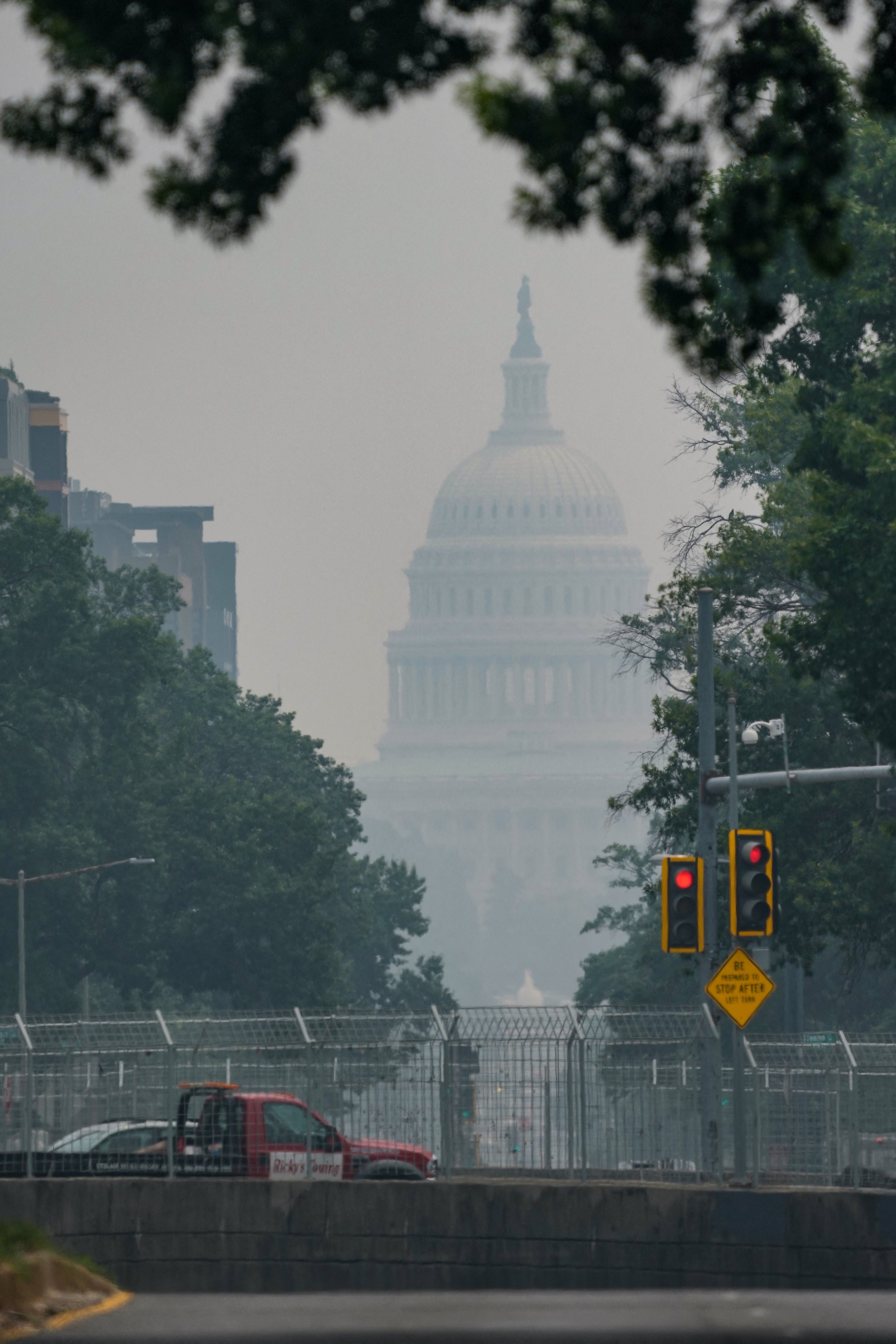 Smoke from Canadian wildfires obscures the US Capitol in Washington, a backdrop to escalating US-Canada trade tensions