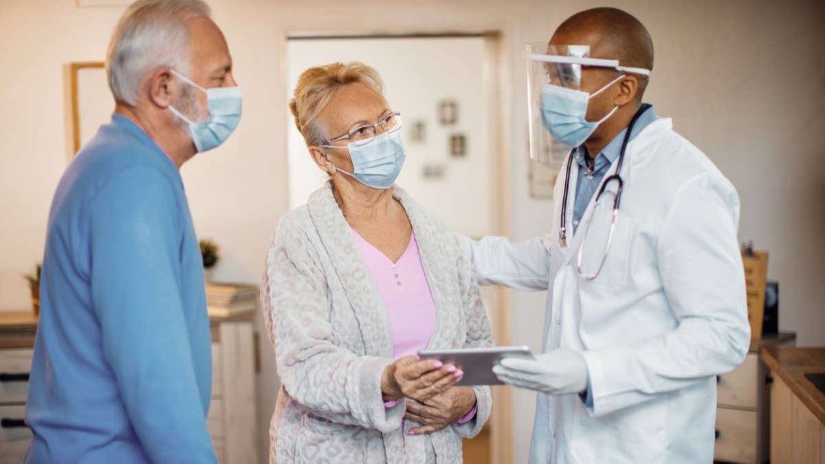 A doctor consults with a patient on cancer treatment options