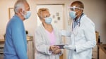 A doctor consults with a patient on cancer treatment options