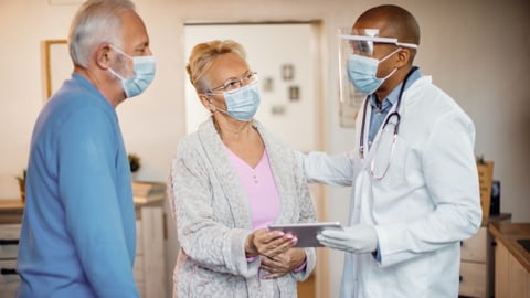 A doctor consults with a patient on cancer treatment options