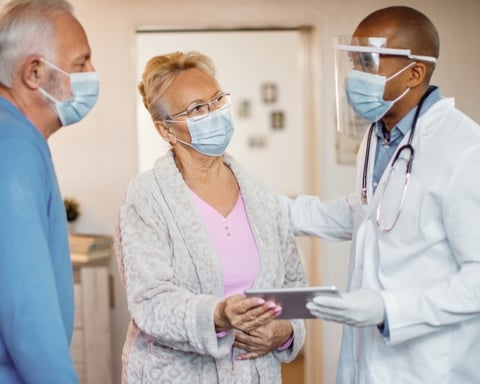 A doctor consults with a patient on cancer treatment options