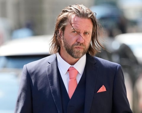 Director Carl Rinsch leaves a federal courthouse in New York after being sentenced to 30 months in prison for defrauding Netflix out of $11 million