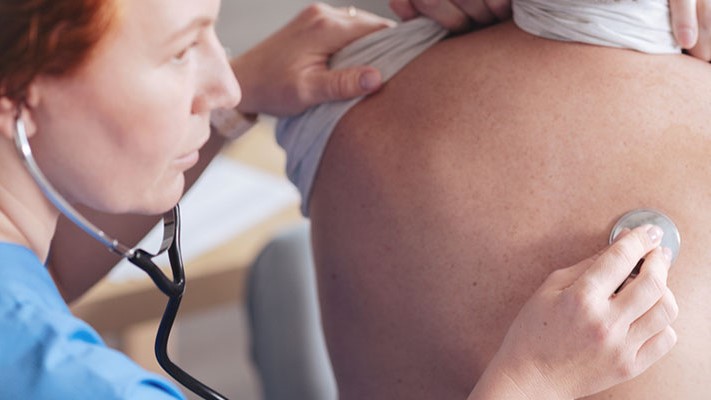 Doctor examining a patient for Legionnaires disease symptoms