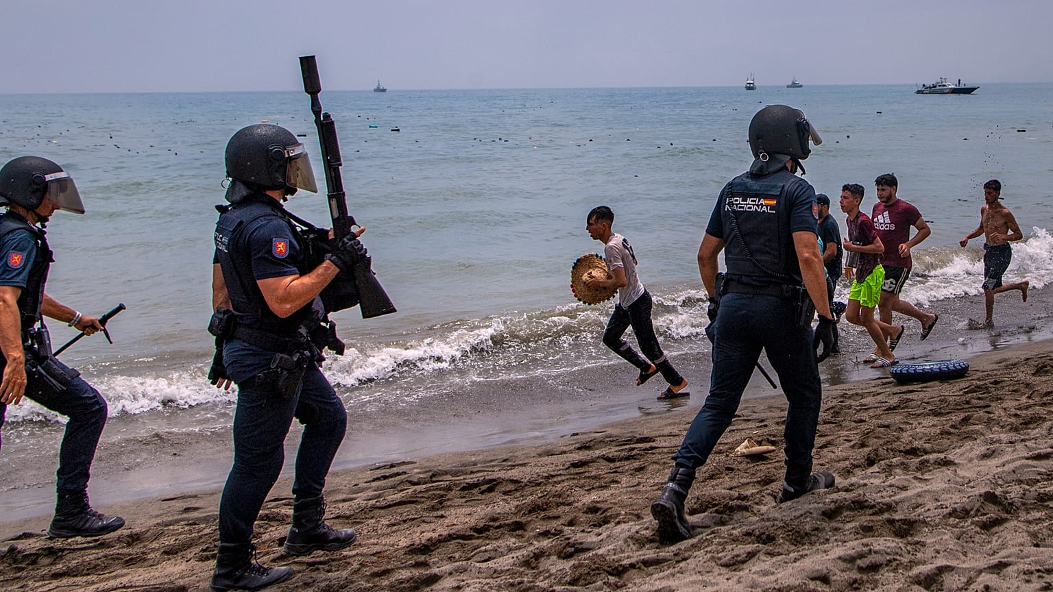 Spanish police intervene as migrants cross from Morocco into Ceuta