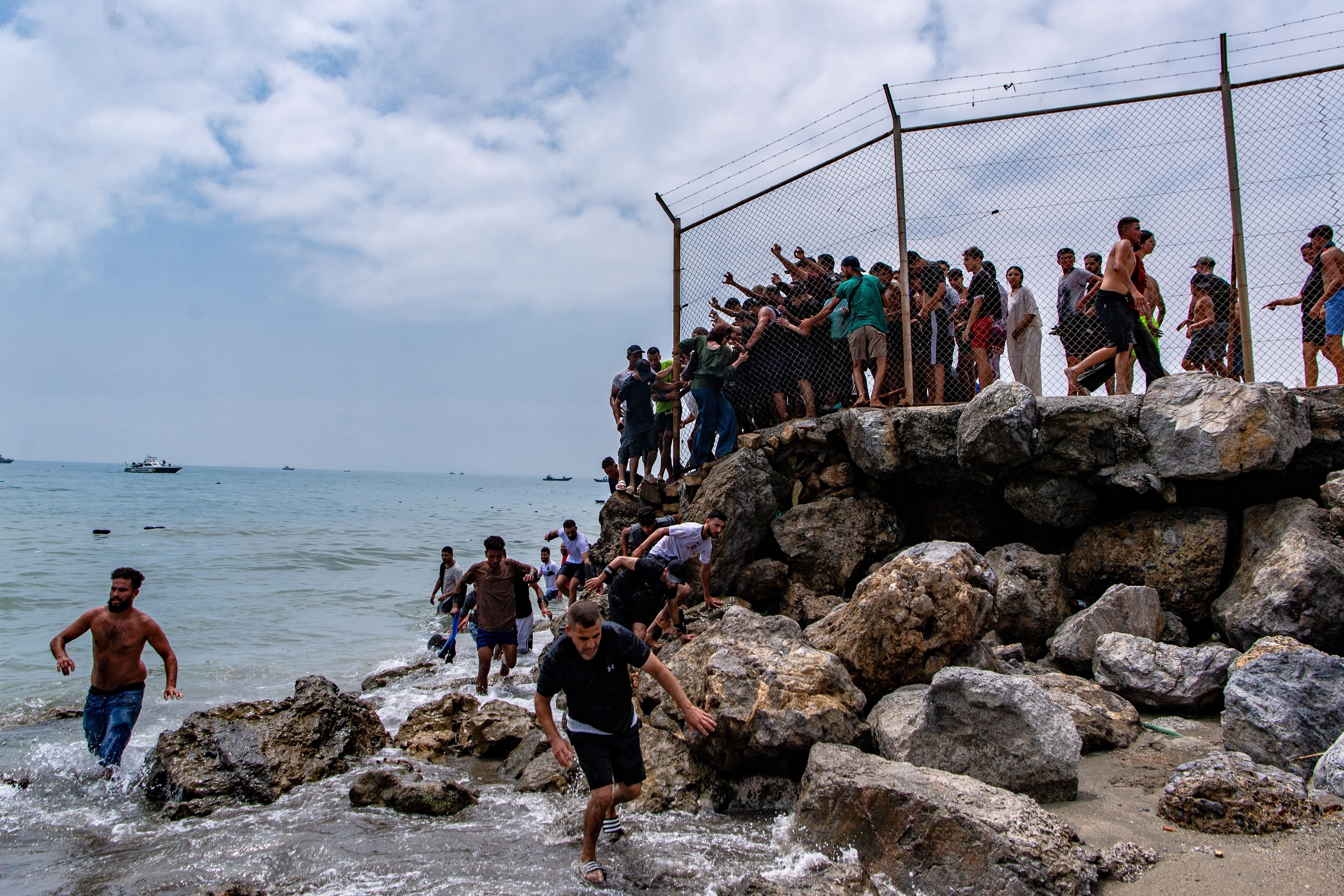 Migrants swimming to reach Spain's Ceuta enclave from Morocco on July 30, 2026