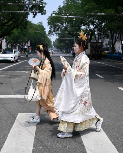 Members of an ethnic minority group in China's Xinjiang region, where Beijing's new ethnic unity law mandates Mandarin as the sole language of instruction from kindergarten