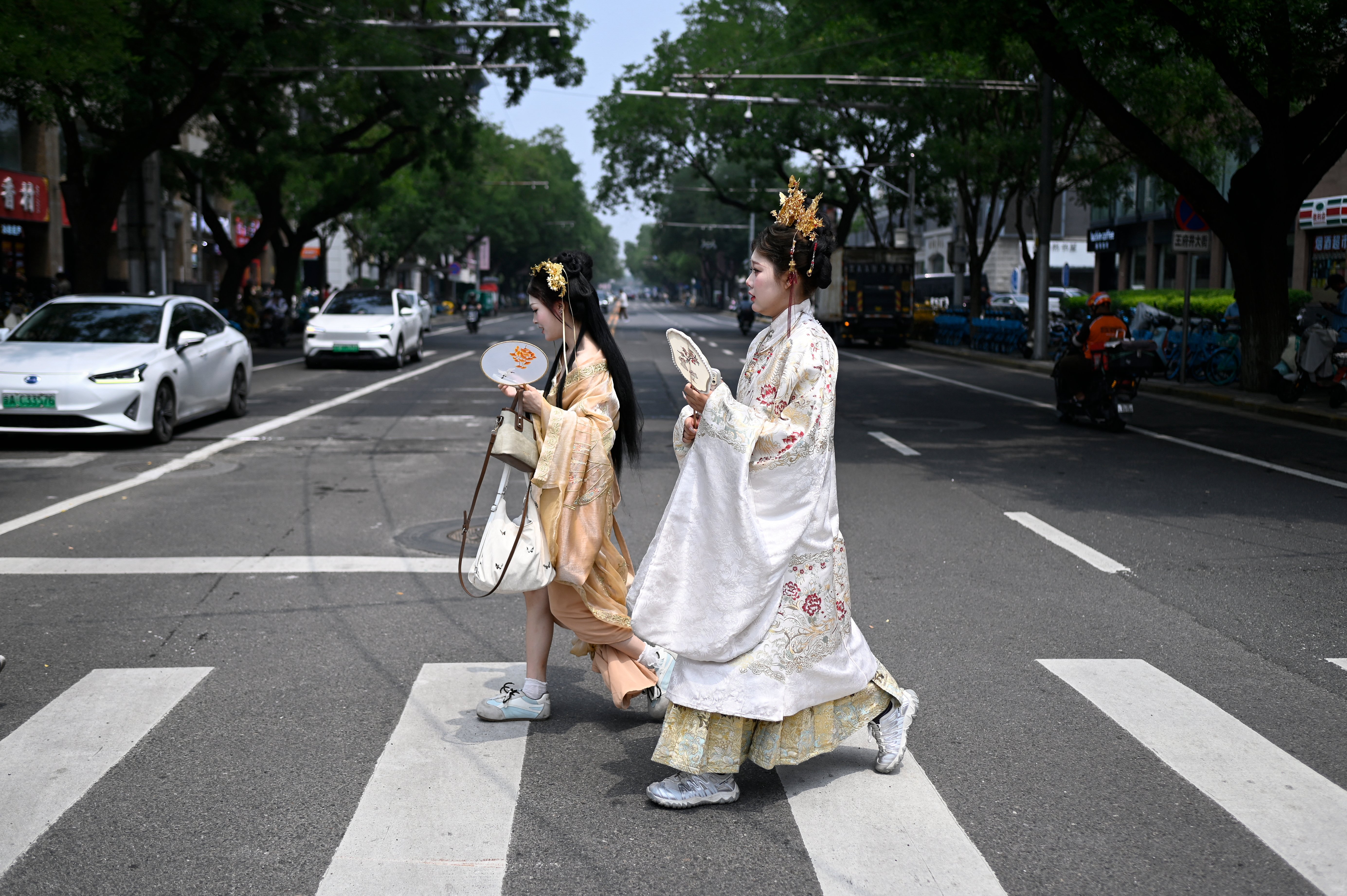 Members of an ethnic minority group in China's Xinjiang region, where Beijing's new ethnic unity law mandates Mandarin as the sole language of instruction from kindergarten