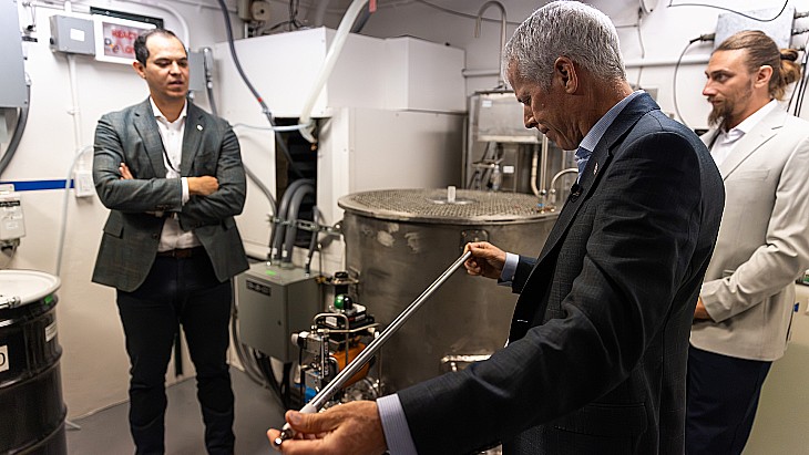 US Energy Secretary Chris Wright holds a fuel rod at Idaho National Laboratory during the Unity microreactor criticality demonstration by Deployable Energy