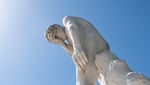 Facepalm statue representing Anthropic Claude AI privacy failure and Google indexing of shared conversations