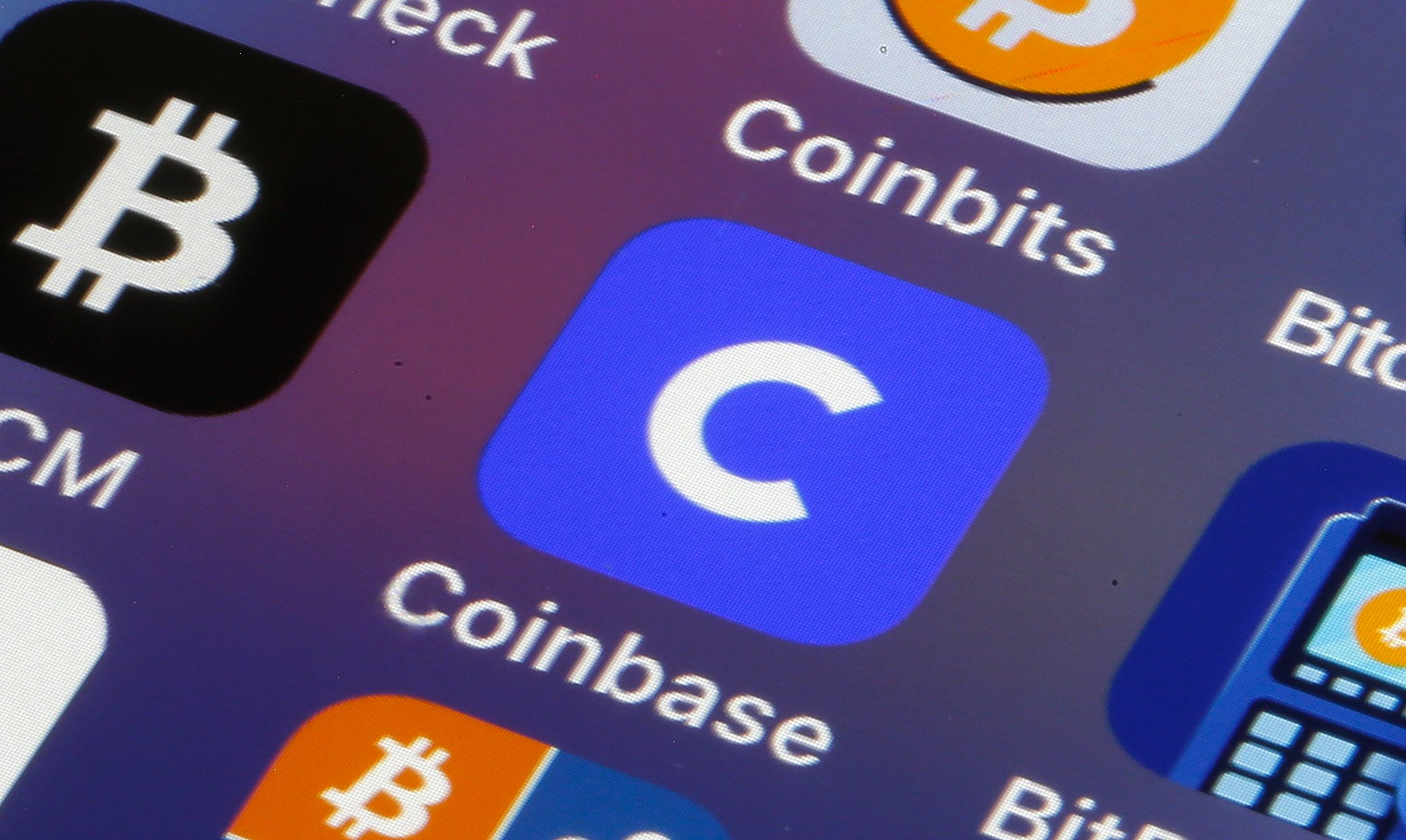 Coinbase logo displayed on a trading screen, representing the crypto exchange's major role in 2026 US midterm election spending