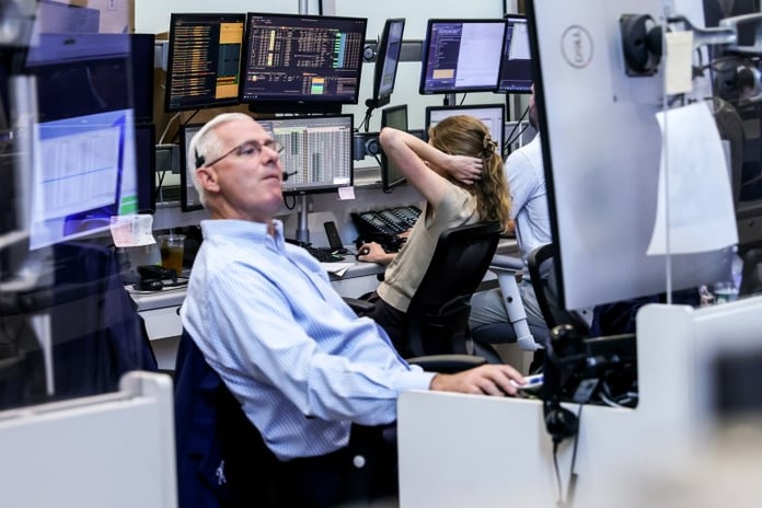Traders on the New York Stock Exchange floor as US consumer confidence falls in July 2026
