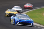 Corey Heim driving No. 67 Field and Stream Toyota leads the field at Indianapolis Motor Speedway during the 2026 Brickyard 400