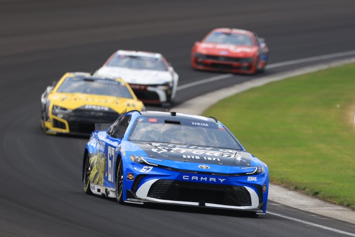 Corey Heim driving No. 67 Field and Stream Toyota leads the field at Indianapolis Motor Speedway during the 2026 Brickyard 400