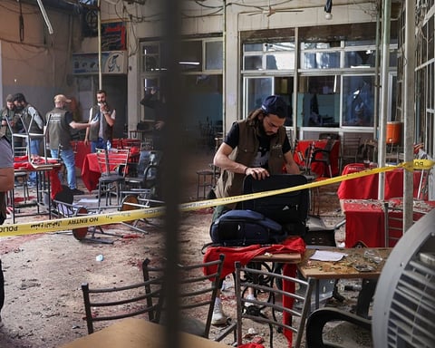Emergency responders at the scene of the Damascus cafe bombing on al-Nasr Street near the Palace of Justice