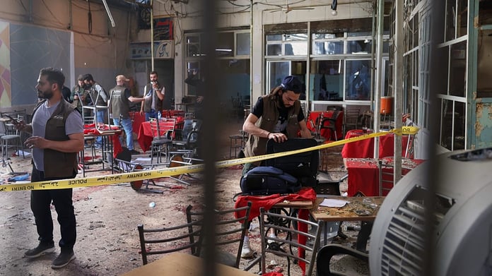 Emergency responders at the scene of the Damascus cafe bombing on al-Nasr Street near the Palace of Justice