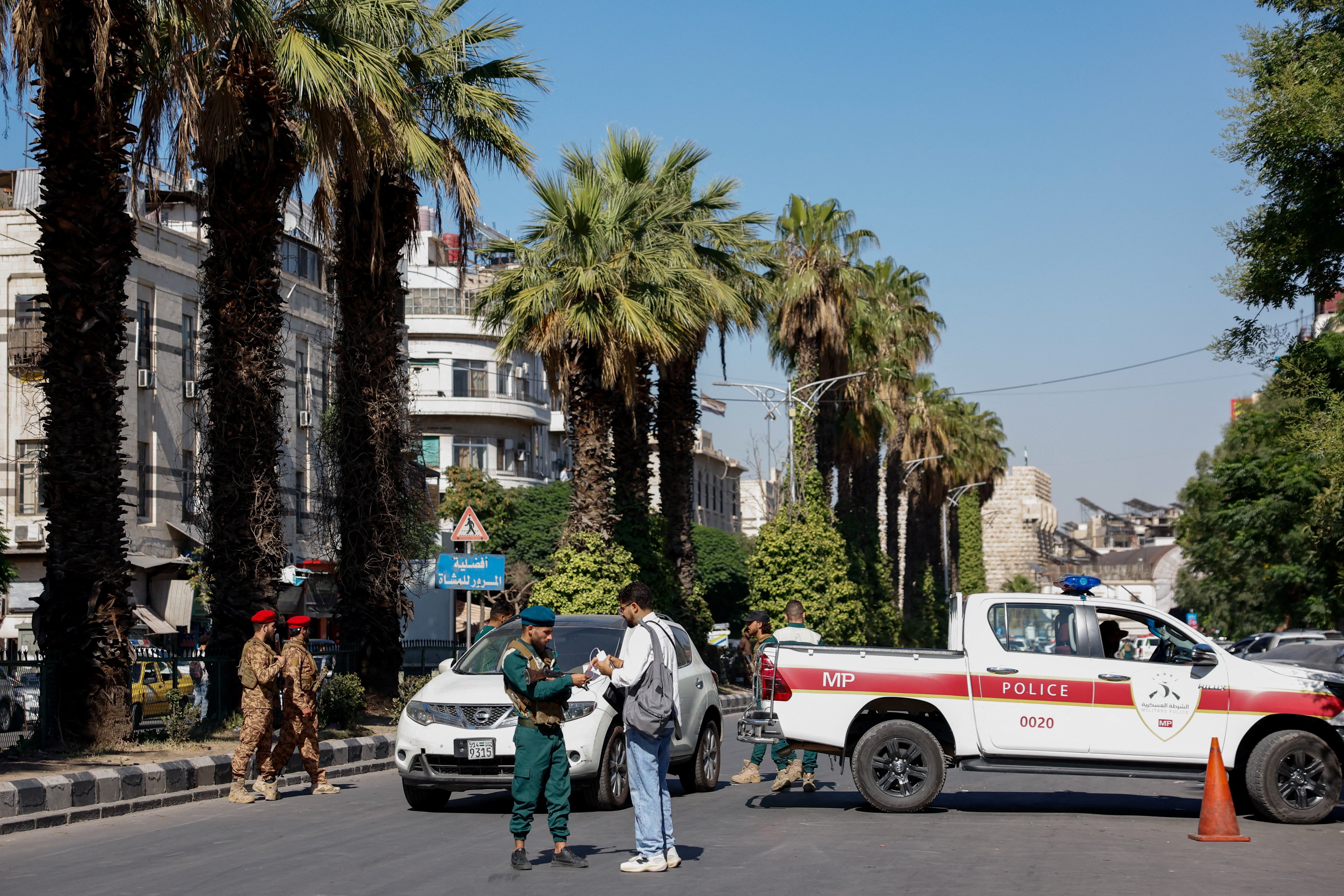 A police vehicle near the site of the café explosion on al-Nasser Street in central Damascus
