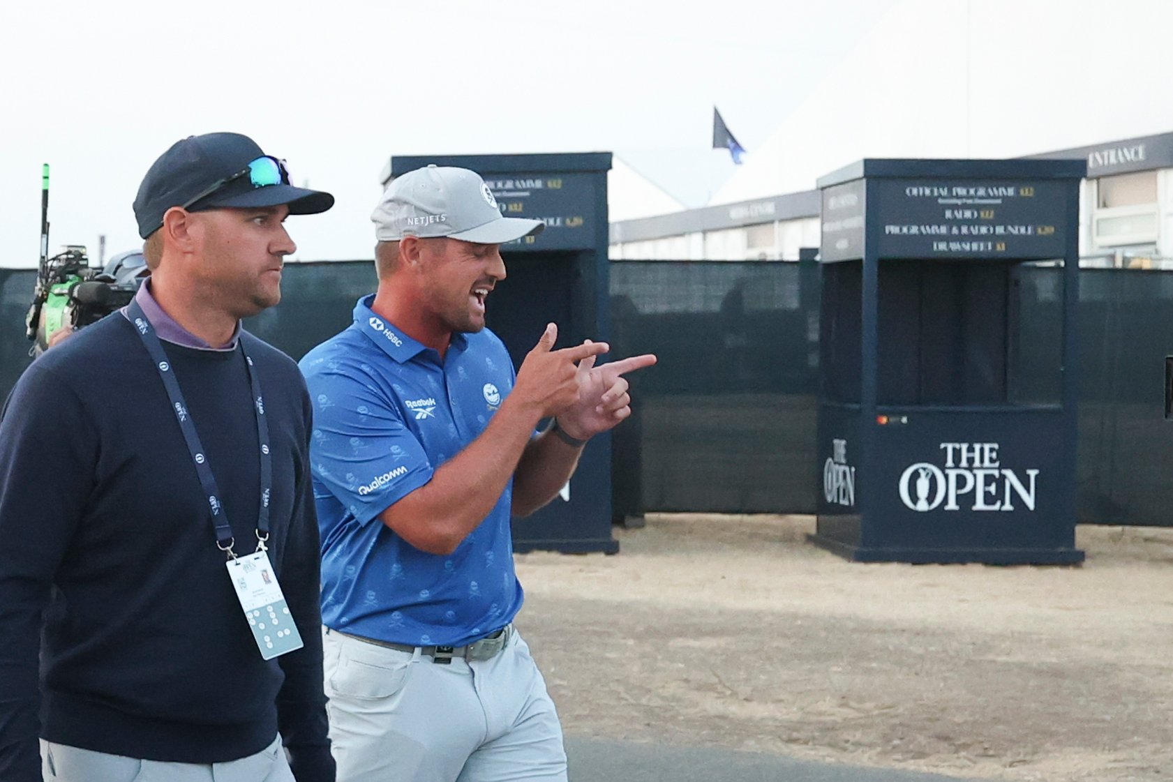 Bryson DeChambeau and his agent Brett Falkoff departing the scoring area at Royal Birkdale after the two-stroke penalty was confirmed
