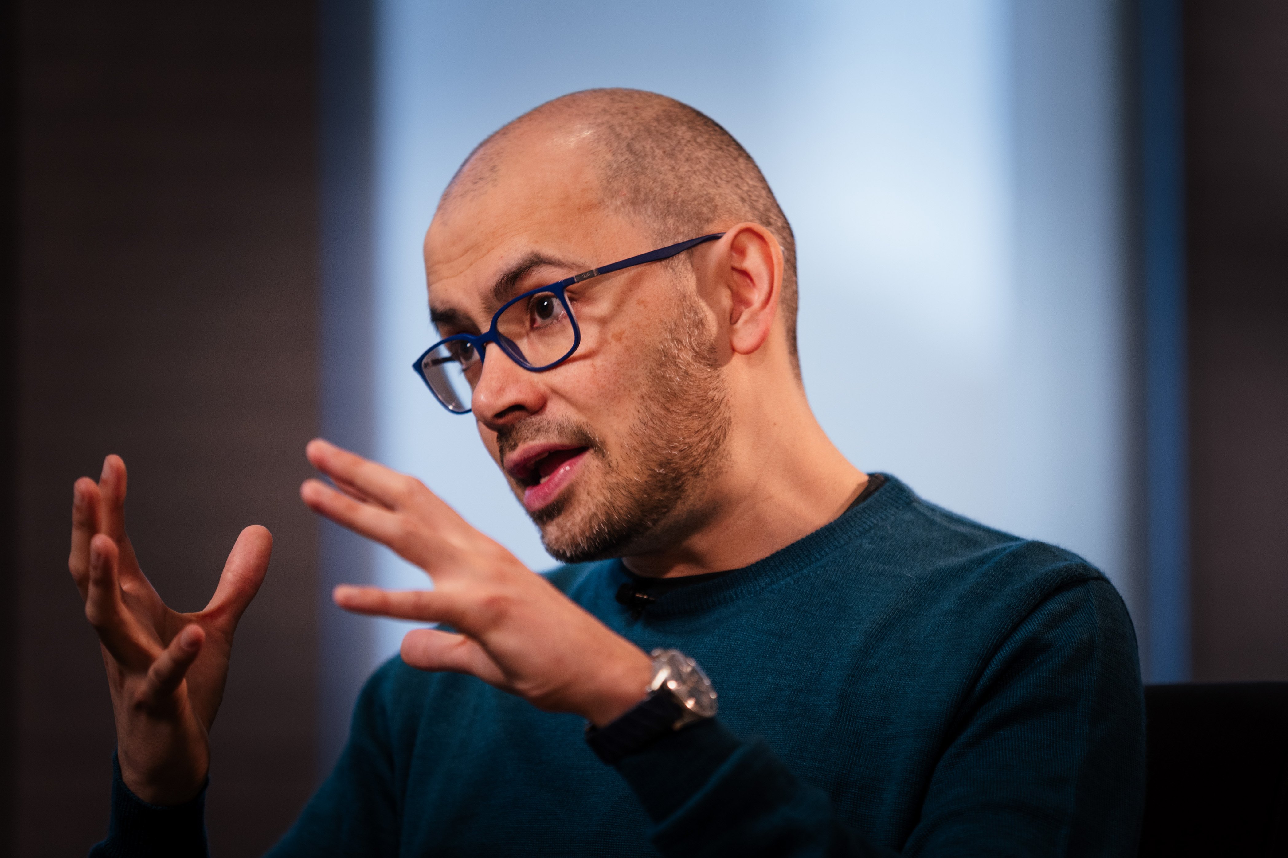 DeepMind CEO Demis Hassabis speaking about AI regulation and a proposed FINRA-style standards body