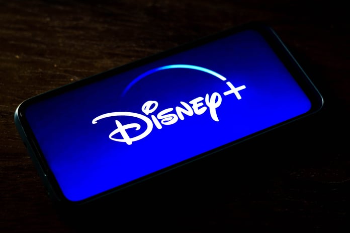 Disney Plus streaming service app displayed on a smartphone screen as company weighs free ad-supported tier