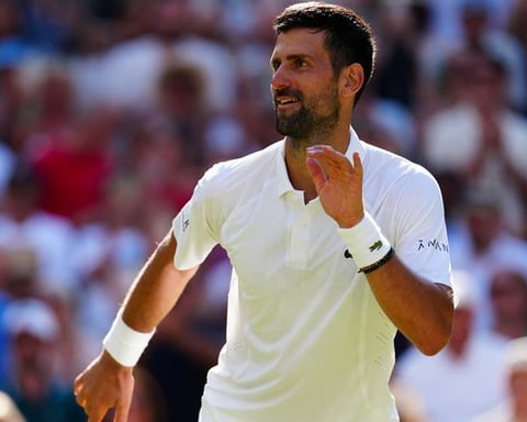 Novak Djokovic on Centre Court at Wimbledon 2026, celebrating after equaling Roger Federer's all-time record of 105 men's wins